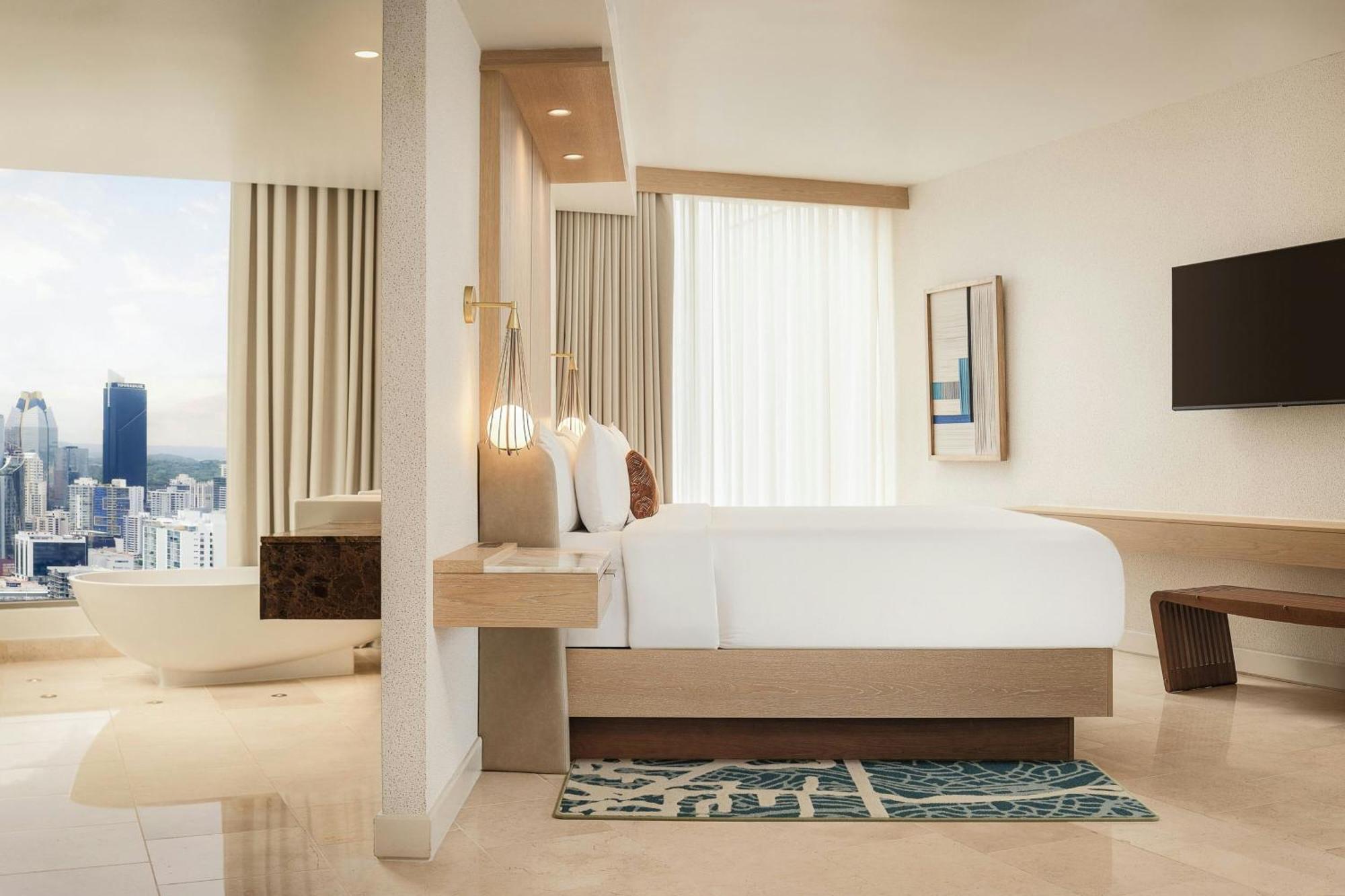 Executive suite king bed balcony partial ocean view