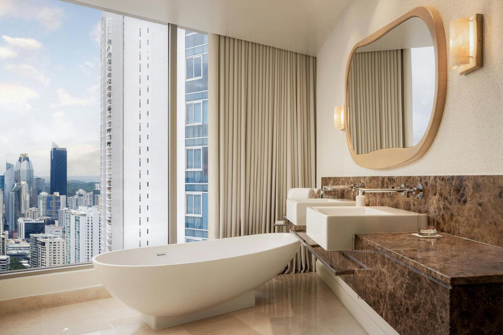 Executive suite king bed balcony partial ocean view