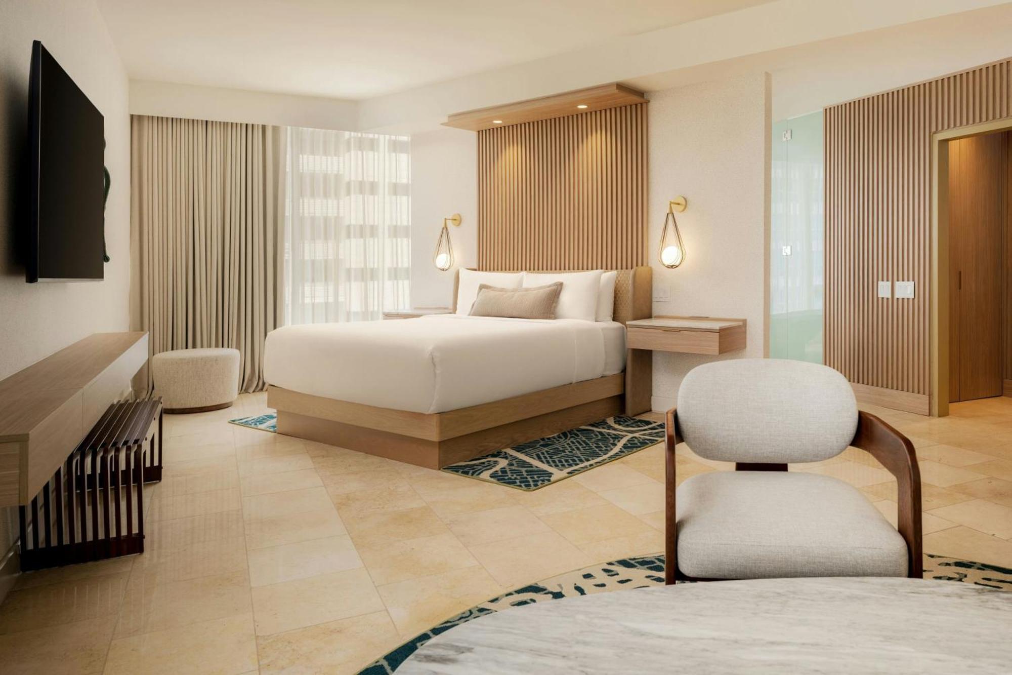 Executive suite king bed balcony partial ocean view