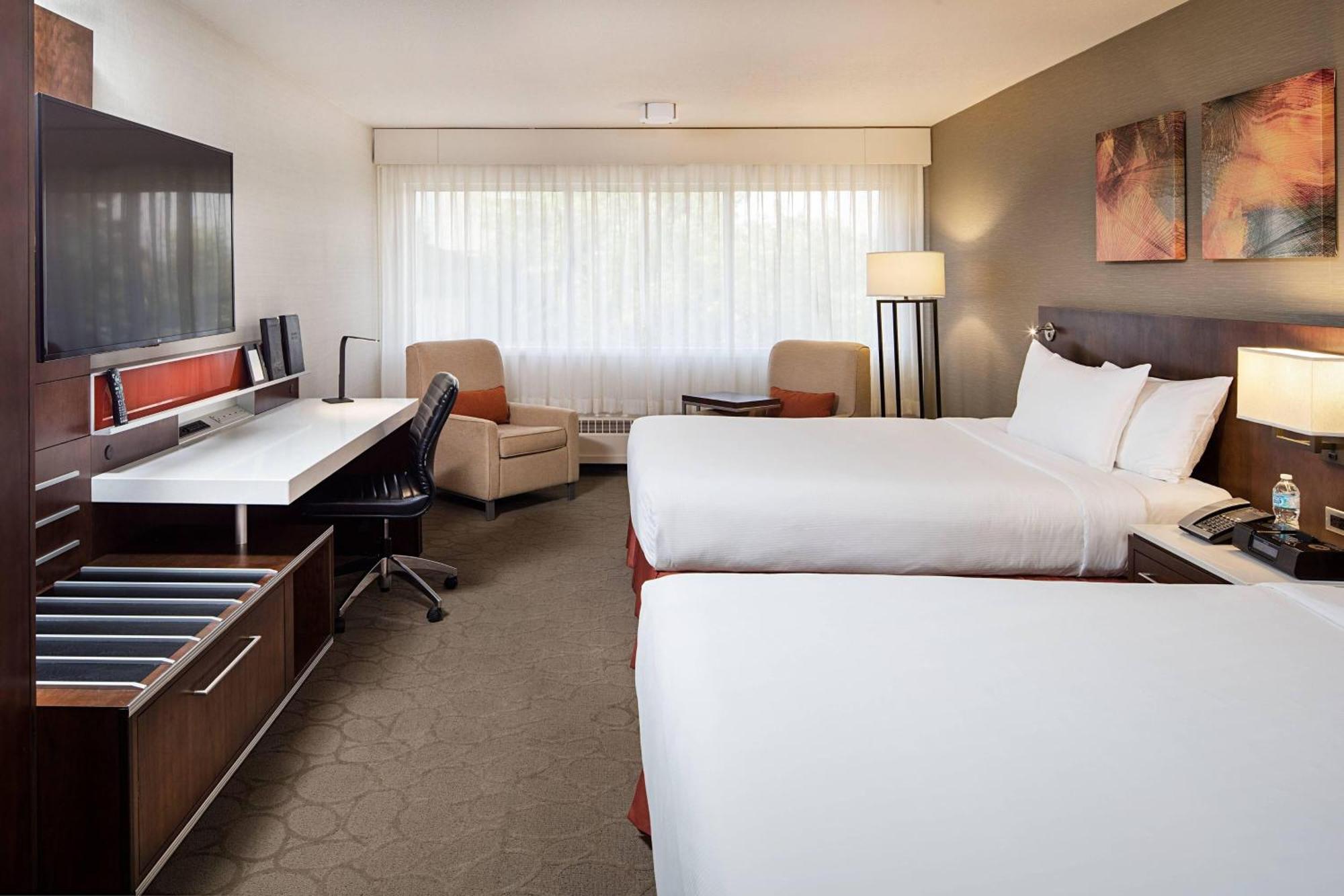 Family Room Two Queen Beds One Bunk Bed Atrium Building